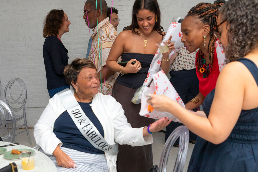 The 90-year-old receiving gifts surrounded by family
