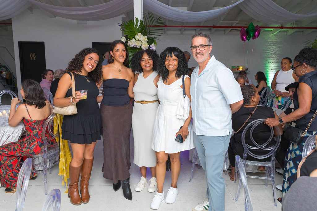 Group of guests including the 30-year-old honoree — the full room behind them