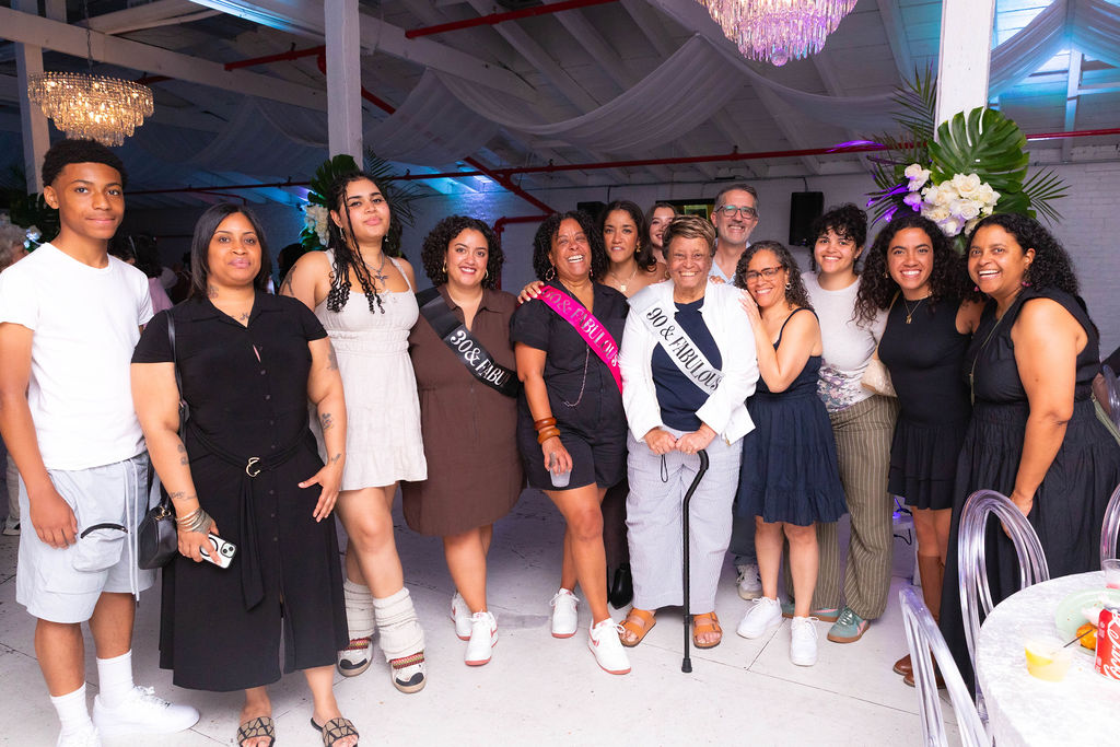 Full family group with all three honorees — 30, 60, and 90 sashes visible