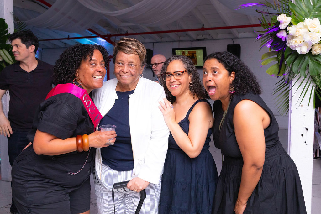 Four women including the grandmother — candid and warm