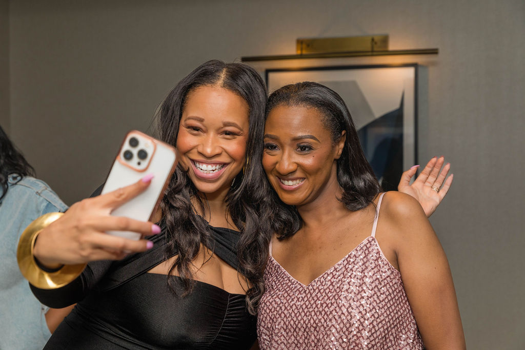 Two women close-up selfie, big smiles