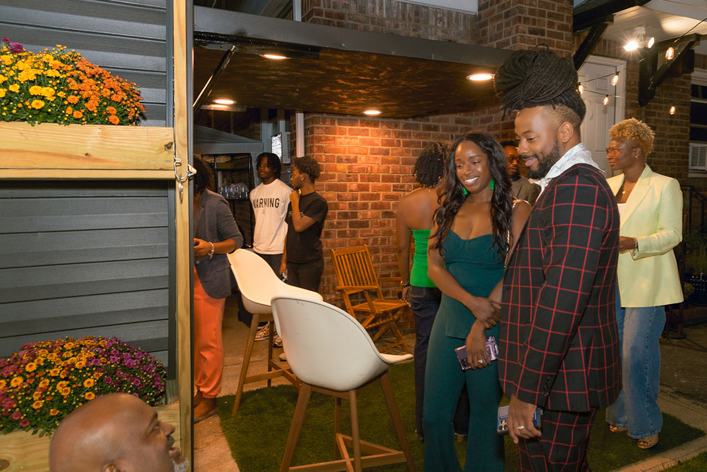 Guests arriving at the outdoor courtyard for the men's annual dinner
