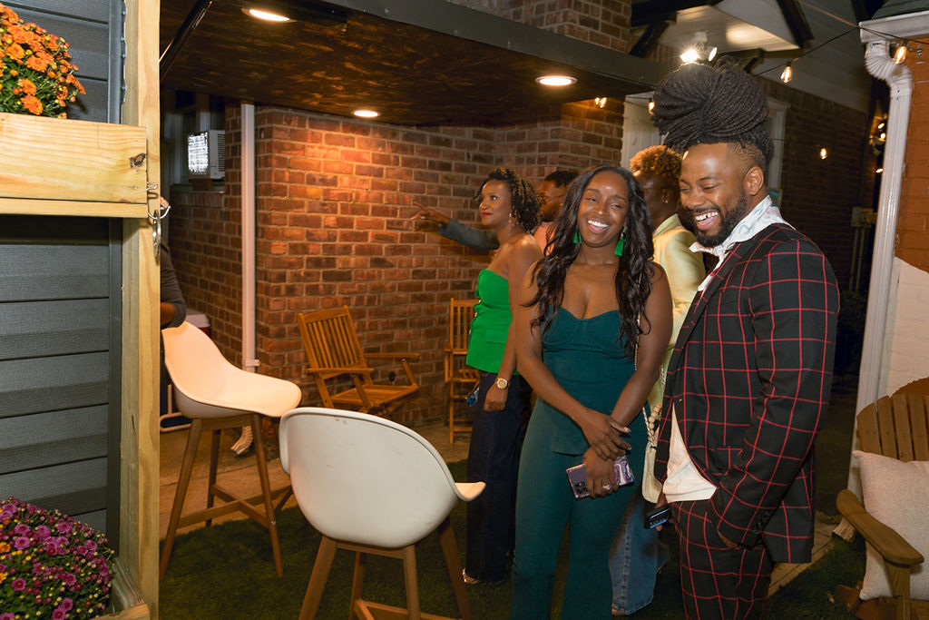 Guests sharing a laugh near the entrance