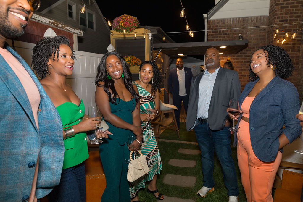 Guests gathered and mingling in the outdoor courtyard