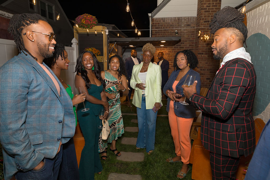 Guests in conversation in the outdoor courtyard