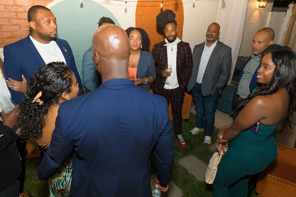 Full group gathered in the indoor lounge