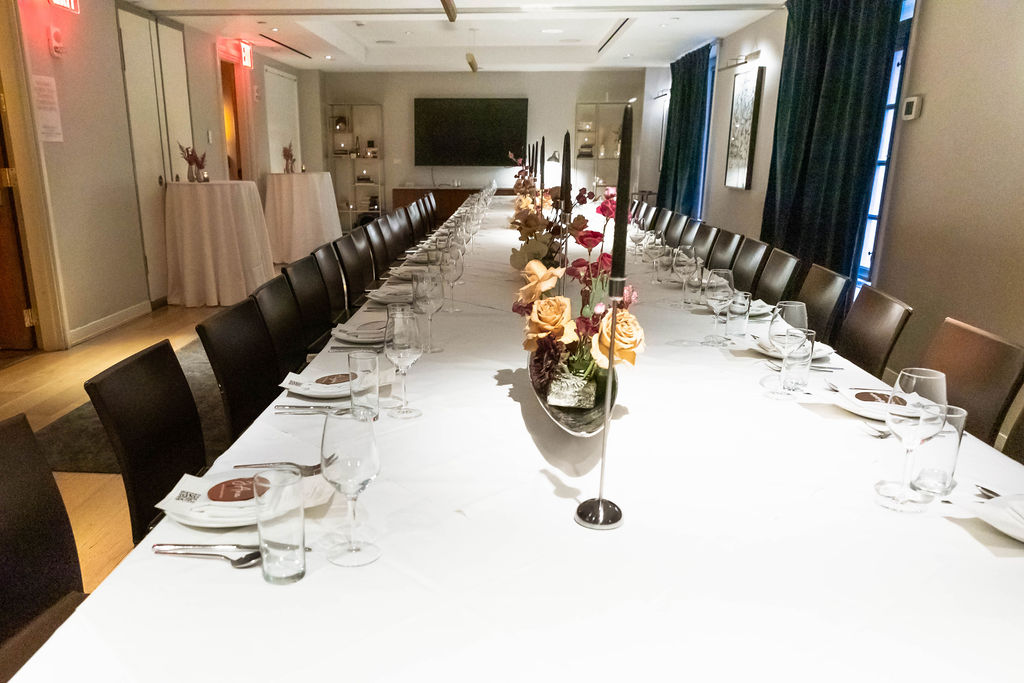 Wide shot of the fully set empty dining room