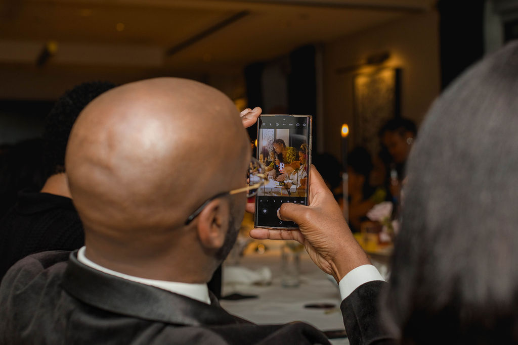 Guest photographing the dinner on his phone