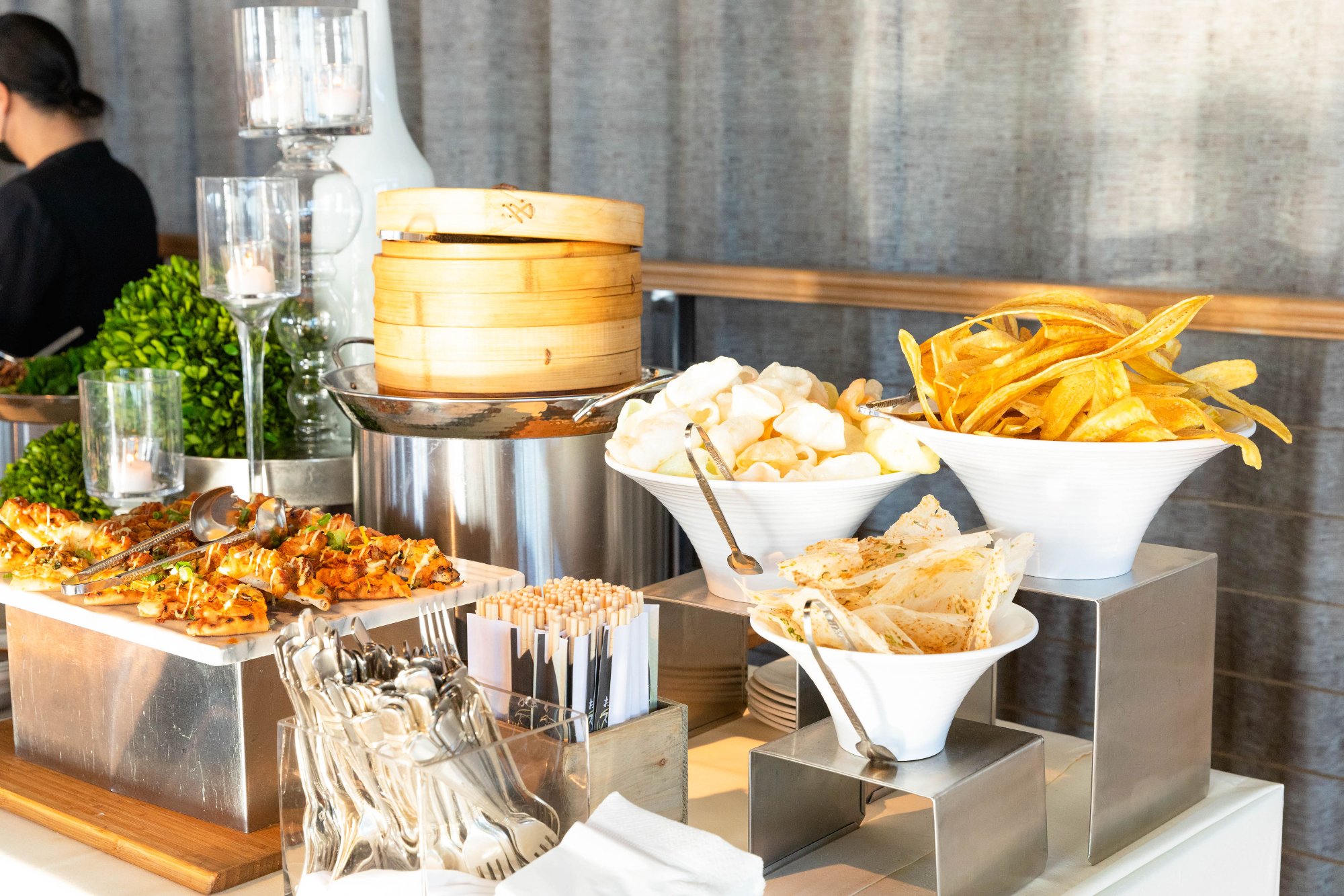 Gala in full motion — guests silhouetted in golden light