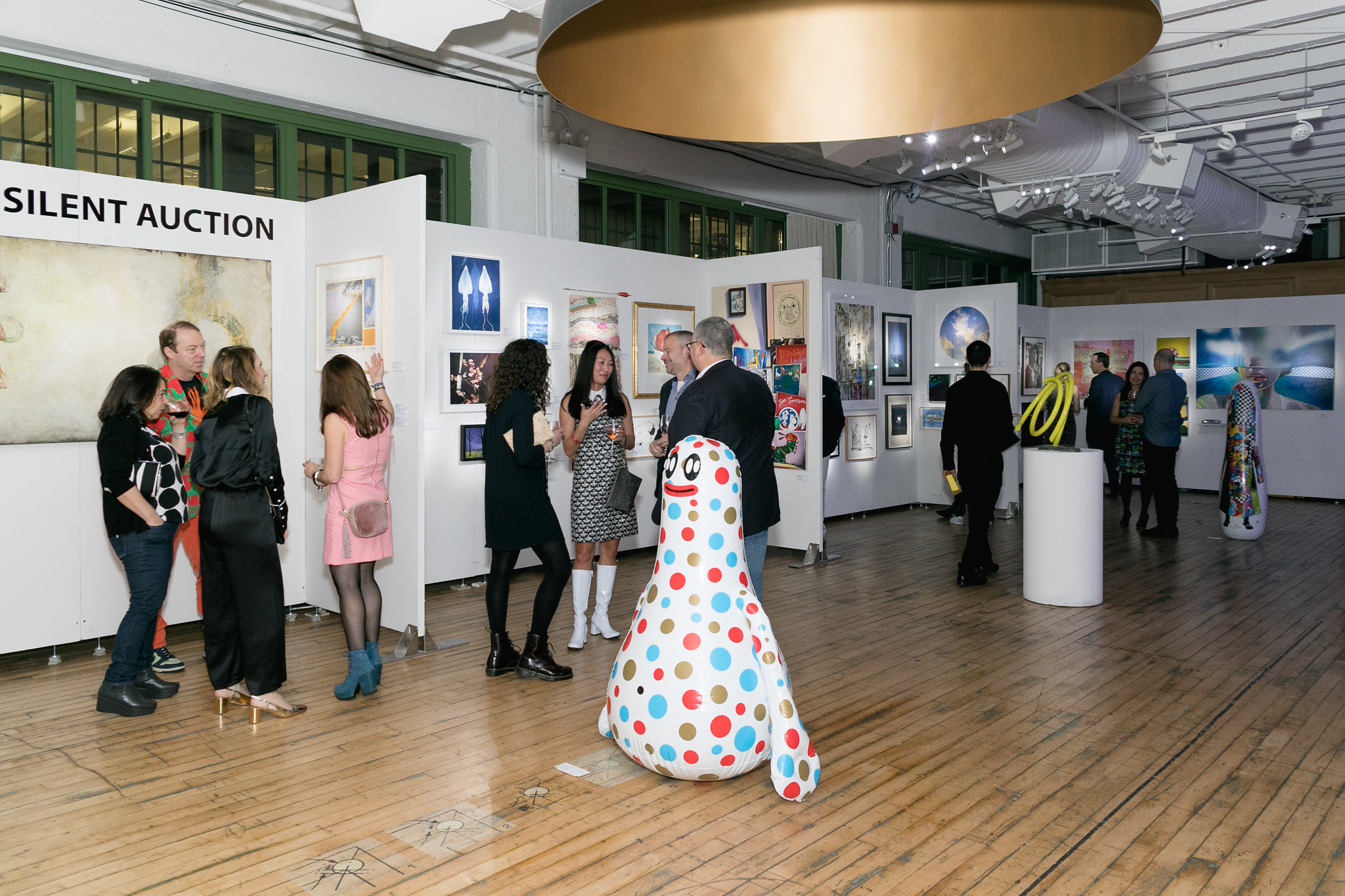 The venue architecture — multi-level, blue light, staircase visible between levels