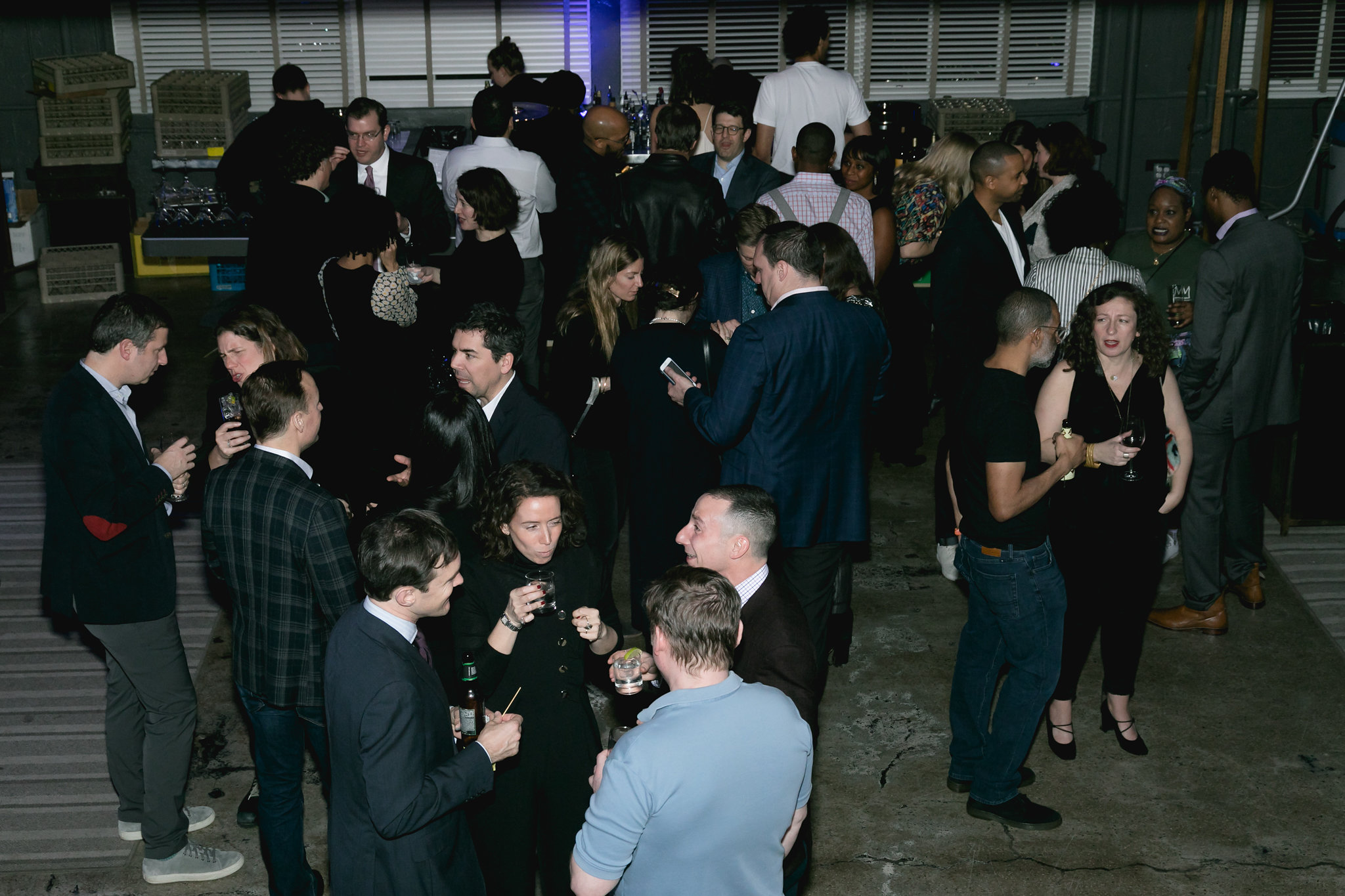 Wide crowd shot — hundreds of guests, the room at capacity, the gala fully alive